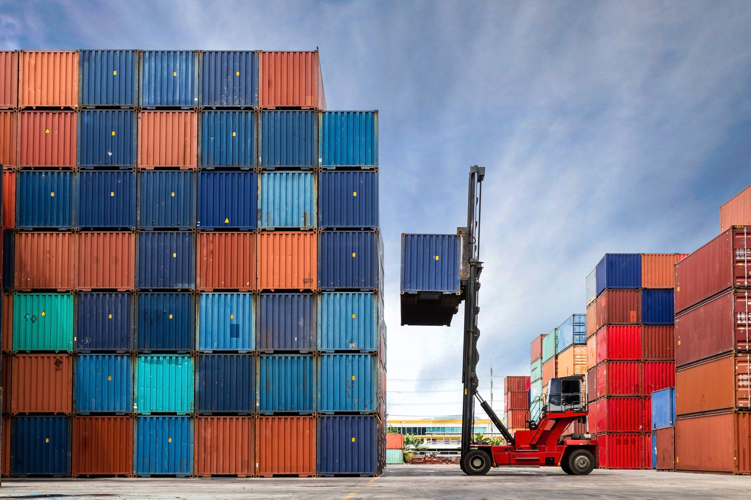 Shipping containers being stacked