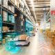 Warehouse using autonomous mobile robots (AMRS) for inventory management and transportation.