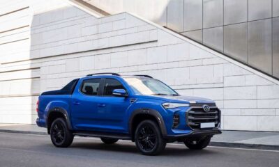 LDV T60 double cab bakkie with a black alloy frame and wheels driving on a road.
