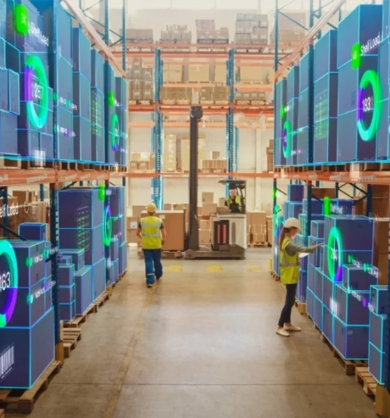 Futuristic illustration of a warehouse with digital packages stacked in a warehouse.