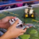 Close up of a high school controlling a remote-control car at a competition.