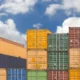 Shipping yard with stacked containers.