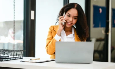 Supply chain leader on a business call in front of her laptop.