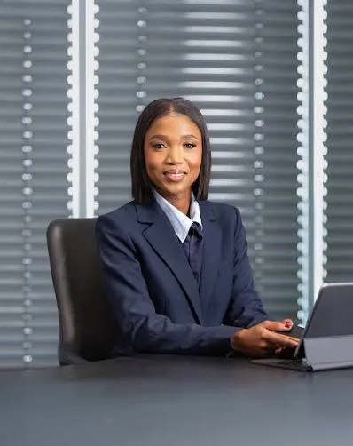 Thabile Makgala, Executive Vice President: People, Risk, SHE and Corporate Affairs at Sasol and a Sasol Foundation Trustee working at her desk.