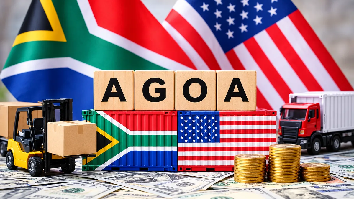 A South African and US flag sitting on a desk with toy freight vehicles transporting goods. In the centre, lies two shipping containers painted with a South African and US flag with letters on top spelling AGOA.