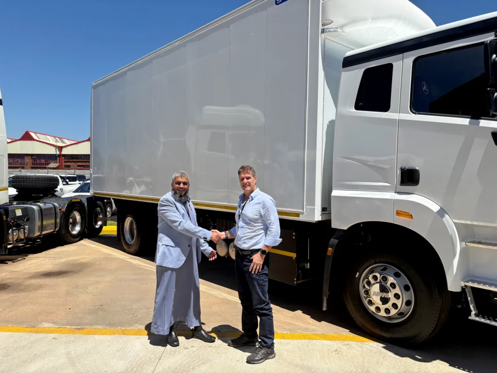 Abdool Tayob CEO of Bakers SA and Clinton Holcroft CEO of Serco handing over the first EV truck and body.