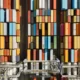 Aerial shot of stacked shipping containers in a shipping yard.