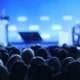 Focused image of panel discussion at a conference.