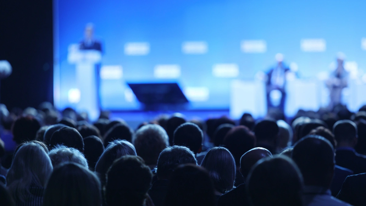 Focused image of panel discussion at a conference.