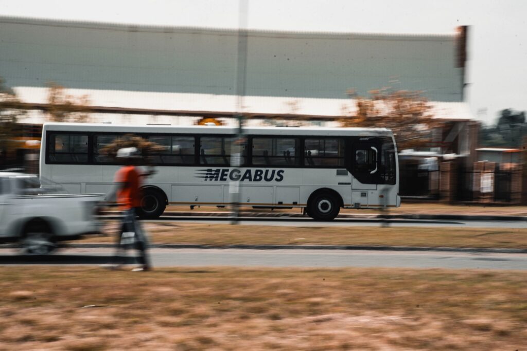Unitrans Megabus driving through the city.