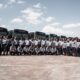 Unitrans team posed in front of their busses.